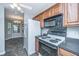 Kitchen with stainless appliances, microwave and view to the dining area at 687 Ponderosa Dr, Charleston, SC 29414