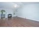 Bright living room with fireplace, fan and wood flooring at 687 Ponderosa Dr, Charleston, SC 29414