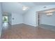 Spacious living room featuring wood flooring, ceiling fan, and natural lighting at 687 Ponderosa Dr, Charleston, SC 29414