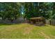 A backyard pergola with wooden railings provides an ideal entertainment space at 687 Ponderosa Dr, Charleston, SC 29414