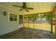 Inviting screened porch with tile floor, ceiling fan, and natural light at 687 Ponderosa Dr, Charleston, SC 29414