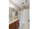 Well-lit bathroom with neutral decor, white shower curtain, and ample counter space at 7 Beach Club Villas, Isle of Palms, SC 29451