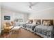 Bedroom featuring three twin beds with gray comforters and woven headboards at 7 Beach Club Villas, Isle of Palms, SC 29451