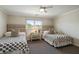 Bedroom featuring two twin beds, neutral decor, and a side table with stylish lamps at 7 Beach Club Villas, Isle of Palms, SC 29451
