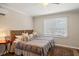 Cozy bedroom with two twin beds, unique headboards, soft lighting, and warm-toned accents at 7 Beach Club Villas, Isle of Palms, SC 29451