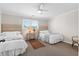 Neutral bedroom featuring two twin beds with patterned throws and a small table at 7 Beach Club Villas, Isle of Palms, SC 29451