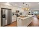 Modern kitchen featuring stainless steel appliances, a kitchen island, and wood flooring at 7 Beach Club Villas, Isle of Palms, SC 29451