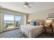 Bright main bedroom with a balcony with an ocean view, neutral decor, and comfortable bed at 7 Beach Club Villas, Isle of Palms, SC 29451