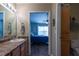 Bathroom features a well-lit vanity and a doorway into a bedroom at 7322 Stoney Moss Way, Hanahan, SC 29410
