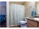 Bathroom featuring a shower with a curtain and a vanity with a framed mirror at 7322 Stoney Moss Way, Hanahan, SC 29410
