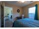 Well-lit bedroom with soothing colors, a workspace, and a comfortable bed at 7322 Stoney Moss Way, Hanahan, SC 29410