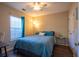 Well-lit bedroom featuring a ceiling fan, bedside tables, and a cozy window nook at 7322 Stoney Moss Way, Hanahan, SC 29410