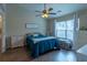 Bright bedroom with a large window providing plenty of natural light at 7322 Stoney Moss Way, Hanahan, SC 29410