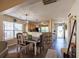 Charming dining area featuring a chandelier and views into the modern kitchen at 7322 Stoney Moss Way, Hanahan, SC 29410