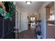 Welcoming entryway with hardwood floors, leading into an open-concept living space at 7322 Stoney Moss Way, Hanahan, SC 29410
