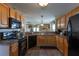 Well-lit kitchen featuring modern appliances, wooden cabinets, and an open layout at 7322 Stoney Moss Way, Hanahan, SC 29410