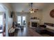 Cozy living room featuring a fireplace, comfortable seating and a doorway to the patio at 7322 Stoney Moss Way, Hanahan, SC 29410