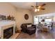Comfortable living room showcasing a fireplace, stylish furnishings and views to dining area at 7322 Stoney Moss Way, Hanahan, SC 29410