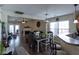 Open-concept living room and dining area, connected to the kitchen with a cozy fireplace at 7322 Stoney Moss Way, Hanahan, SC 29410