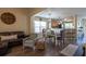 Spacious living room featuring ample seating and a view into the dining area at 7322 Stoney Moss Way, Hanahan, SC 29410
