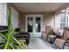 A cozy covered porch with seating area, perfect for enjoying the outdoors while protected from the elements at 7322 Stoney Moss Way, Hanahan, SC 29410