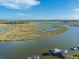 Aerial view of a river landscape with winding waterways at 7897 Russell Creek Dr, Edisto Island, SC 29438