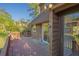 Spacious outdoor deck with wood railings and a view of the surrounding landscape at 7897 Russell Creek Dr, Edisto Island, SC 29438