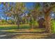 View of the yard featuring large trees and lush vegetation at 7897 Russell Creek Dr, Edisto Island, SC 29438