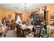 Traditional dining room featuring a wooden table, decorative china cabinet, and unique chandelier lighting fixture at 8475 N Scotts Mill Dr, North Charleston, SC 29420
