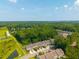 Aerial view of townhomes surrounded by lush greenery and a scenic landscape at 854 Bibury Ct, Charleston, SC 29414