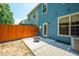 Cozy backyard features a charming patio, bordered by a wooden fence, creating an inviting outdoor retreat at 854 Bibury Ct, Charleston, SC 29414