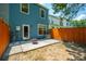 Private backyard features a cozy patio, fire pit, and wooden fencing, creating a tranquil space for relaxation and outdoor enjoyment at 854 Bibury Ct, Charleston, SC 29414