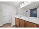 Bathroom with dual sink vanity, large mirror, and separate shower space at 854 Bibury Ct, Charleston, SC 29414