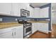 Kitchen featuring stainless steel appliances, granite countertops, and white cabinets at 854 Bibury Ct, Charleston, SC 29414