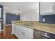 Kitchen featuring granite countertops, white cabinets, and stainless steel appliances at 854 Bibury Ct, Charleston, SC 29414