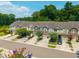 Inviting street view showcases townhomes with lush landscaping, offering a picturesque glimpse of community living and curb appeal at 854 Bibury Ct, Charleston, SC 29414