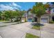 Street view showcases townhomes with garages and vibrant trees, creating an appealing residential setting with a welcoming atmosphere at 854 Bibury Ct, Charleston, SC 29414