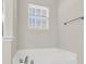 Corner soaking tub with a window for natural light at 9253 N Moreto Cir, Summerville, SC 29485