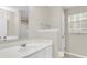 Bathroom features a white vanity, mirror, and window for natural light at 9253 N Moreto Cir, Summerville, SC 29485