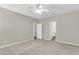 Spacious bedroom with ceiling fan and ensuite bathroom at 9253 N Moreto Cir, Summerville, SC 29485