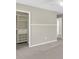 Open closet with wire baskets, cabinets, and built in shelving with easy access from the carpeted room at 9253 N Moreto Cir, Summerville, SC 29485
