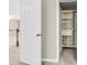 Open closet featuring wire baskets, cabinets, and built in shelving with an open view to the upper level at 9253 N Moreto Cir, Summerville, SC 29485