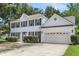 Beautiful two-story home with white siding, green shutters, and attached two-car garage at 9253 N Moreto Cir, Summerville, SC 29485