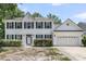 Charming two-story home with white siding, black roof, and attached two-car garage at 9253 N Moreto Cir, Summerville, SC 29485
