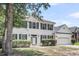 Charming white two-story home with green shutters and a two-car garage at 9253 N Moreto Cir, Summerville, SC 29485