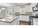 Modern kitchen with white cabinets, stainless steel appliances, and granite countertops at 9253 N Moreto Cir, Summerville, SC 29485