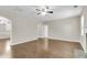 Inviting living room with hardwood floors, ceiling fan, and neutral paint palette at 9253 N Moreto Cir, Summerville, SC 29485