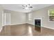 Bright living room features hardwood floors, fireplace with green marble, and neutral paint at 9253 N Moreto Cir, Summerville, SC 29485