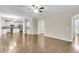 Open concept living room with hardwood floors and seamless flow to the kitchen at 9253 N Moreto Cir, Summerville, SC 29485
