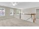 Spacious upstairs loft area with neutral walls, carpet and natural lighting at 9253 N Moreto Cir, Summerville, SC 29485